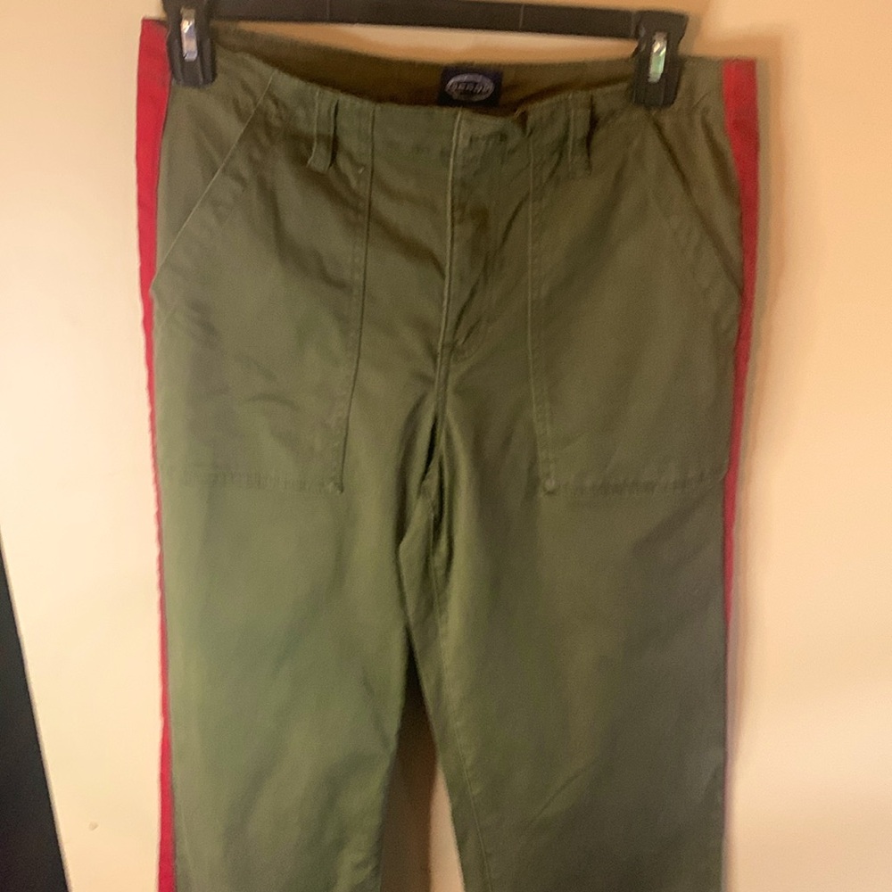 Olive green casual pants with red side stripes.